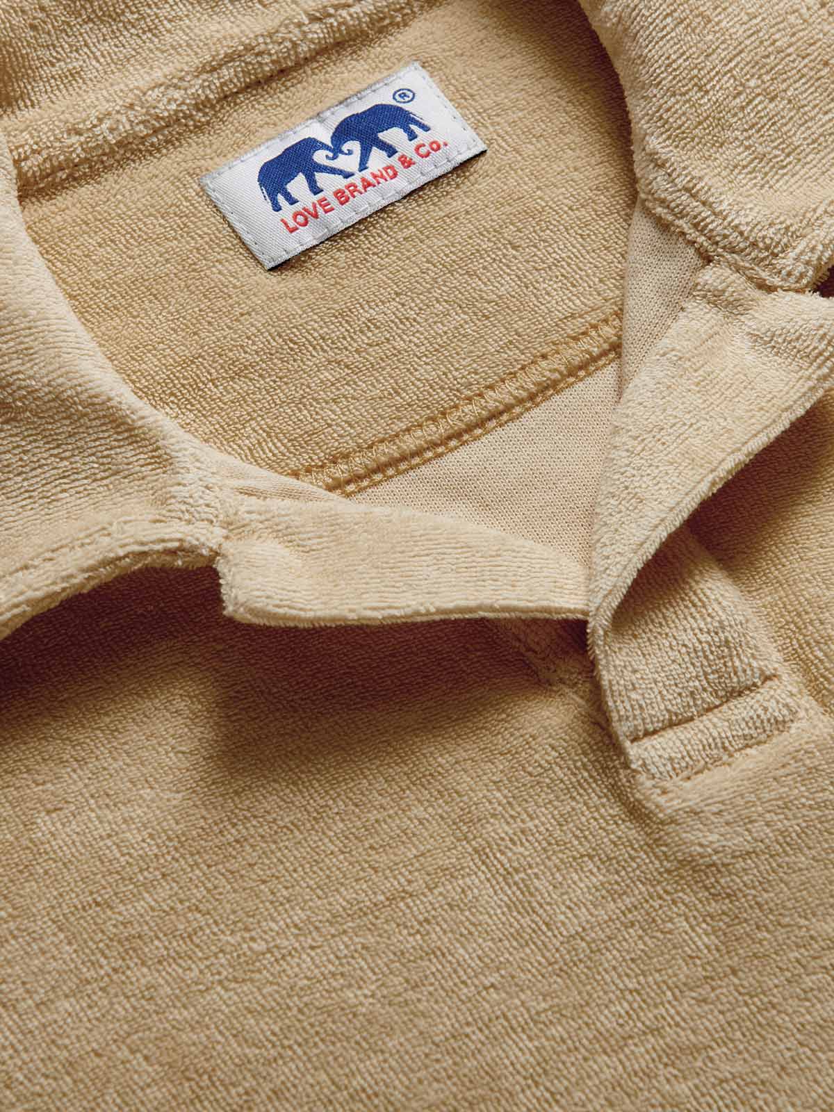 Detailed view of Kids Coconut Powell Terry Polo fabric made from 100% cotton.