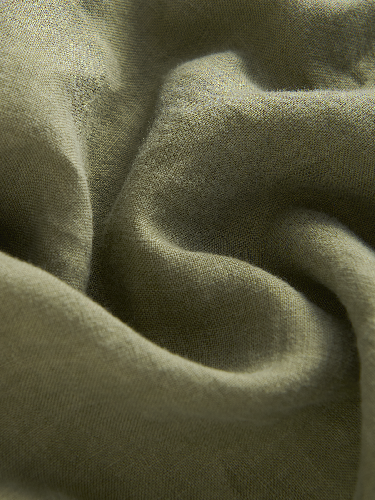 Close-up of green linen fabric texture