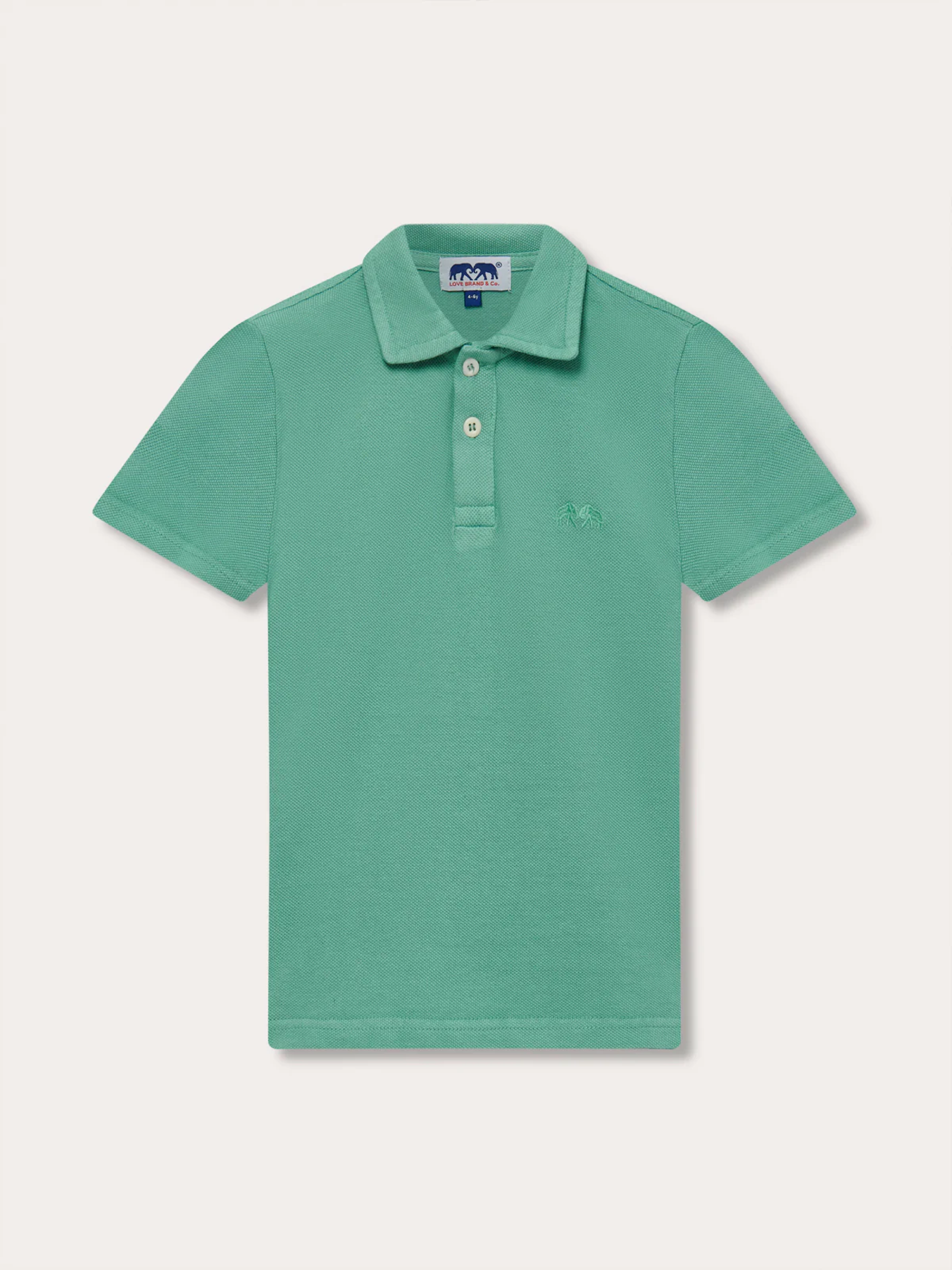 Front view of a kids green polo shirt