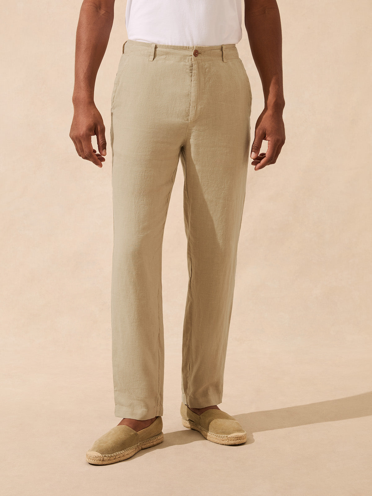 Man wearing beige linen trousers with espadrilles