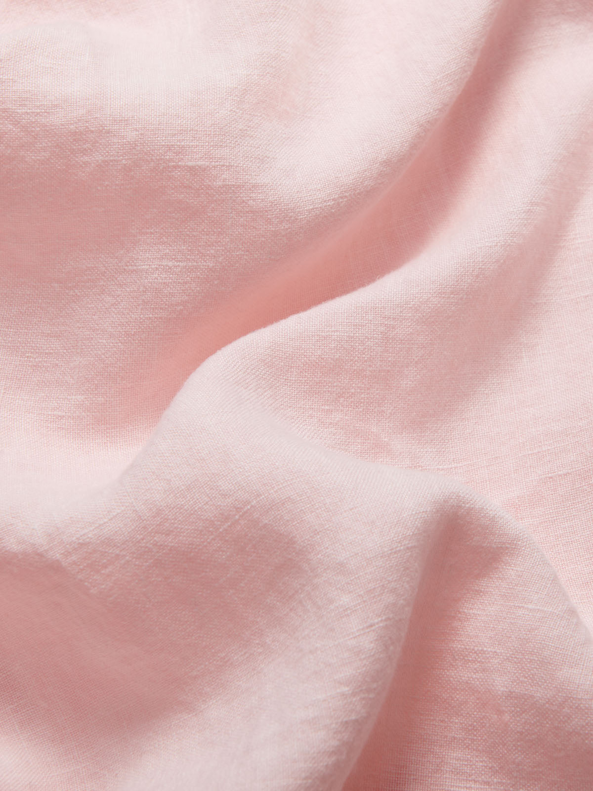 Detailed view of Men's Pastel Pink Joulter Linen Shorts. mens pastel pink shorts with drawstring waist and 2 handy front pockets made from 100% linen.