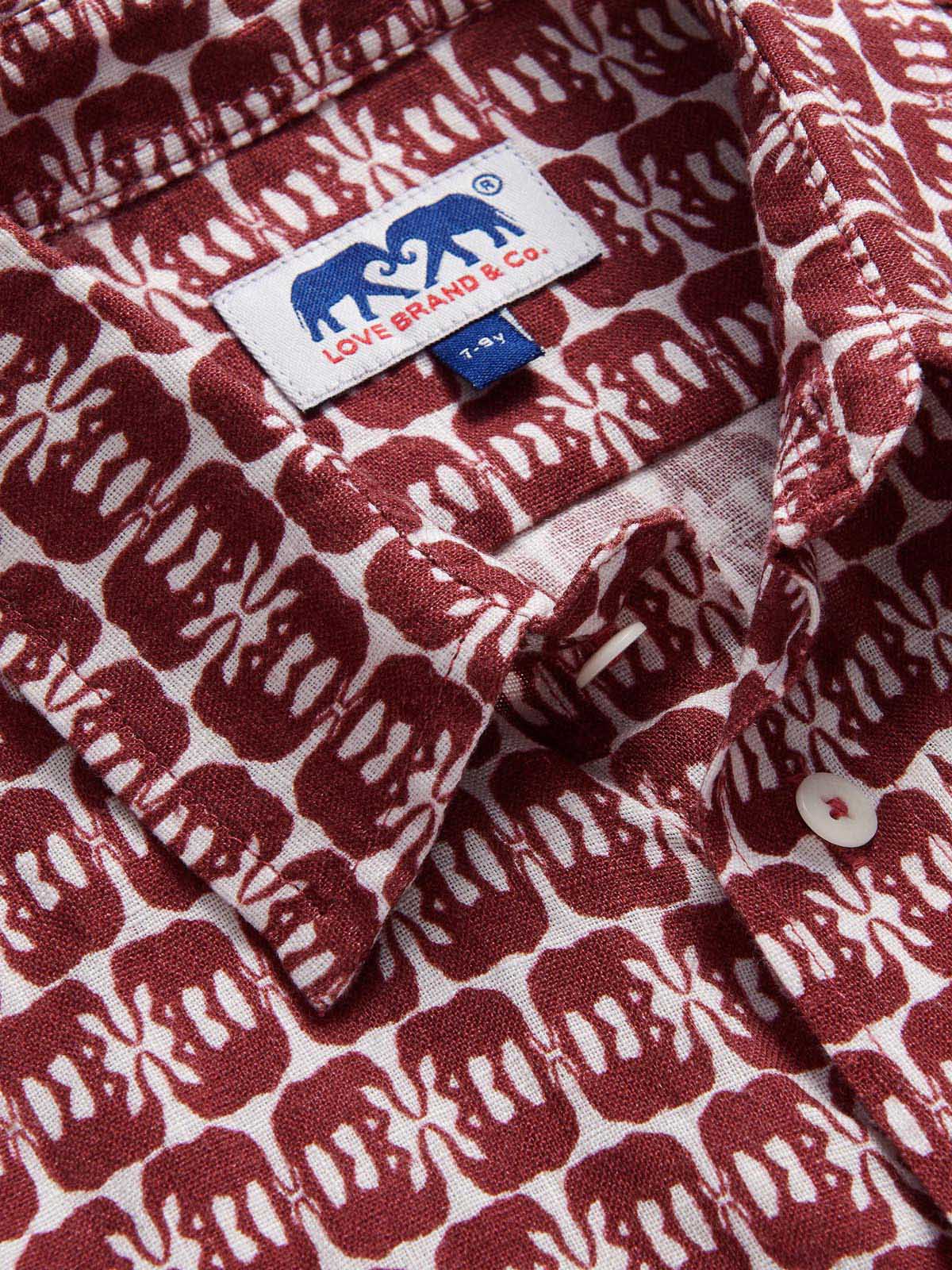 Boys Elephants of India Abaco Linen Shirt with dark burgundy elephants on a crisp white background.