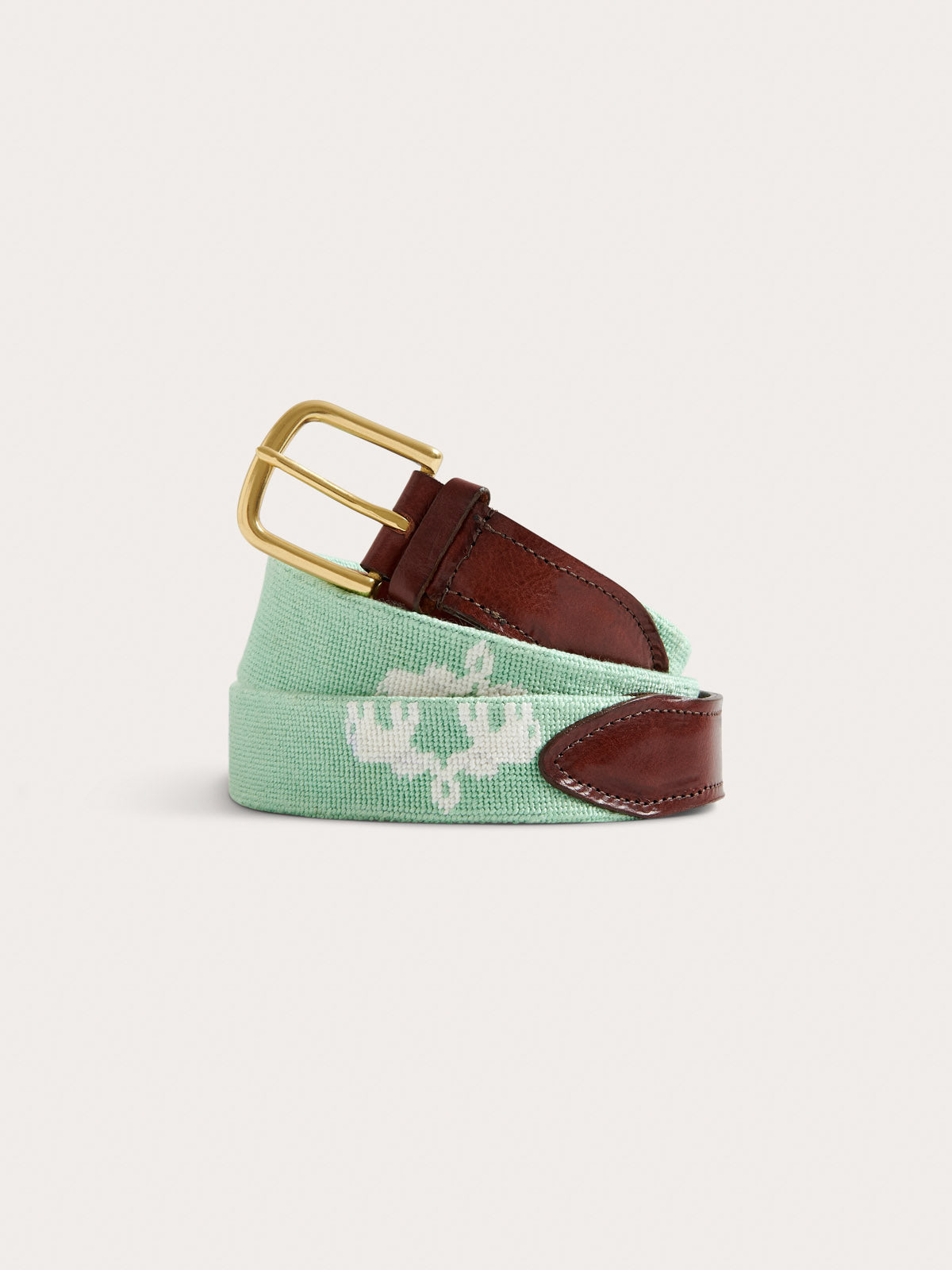 sea glass green leather belt round view. Showing brass buckle and elephant design.