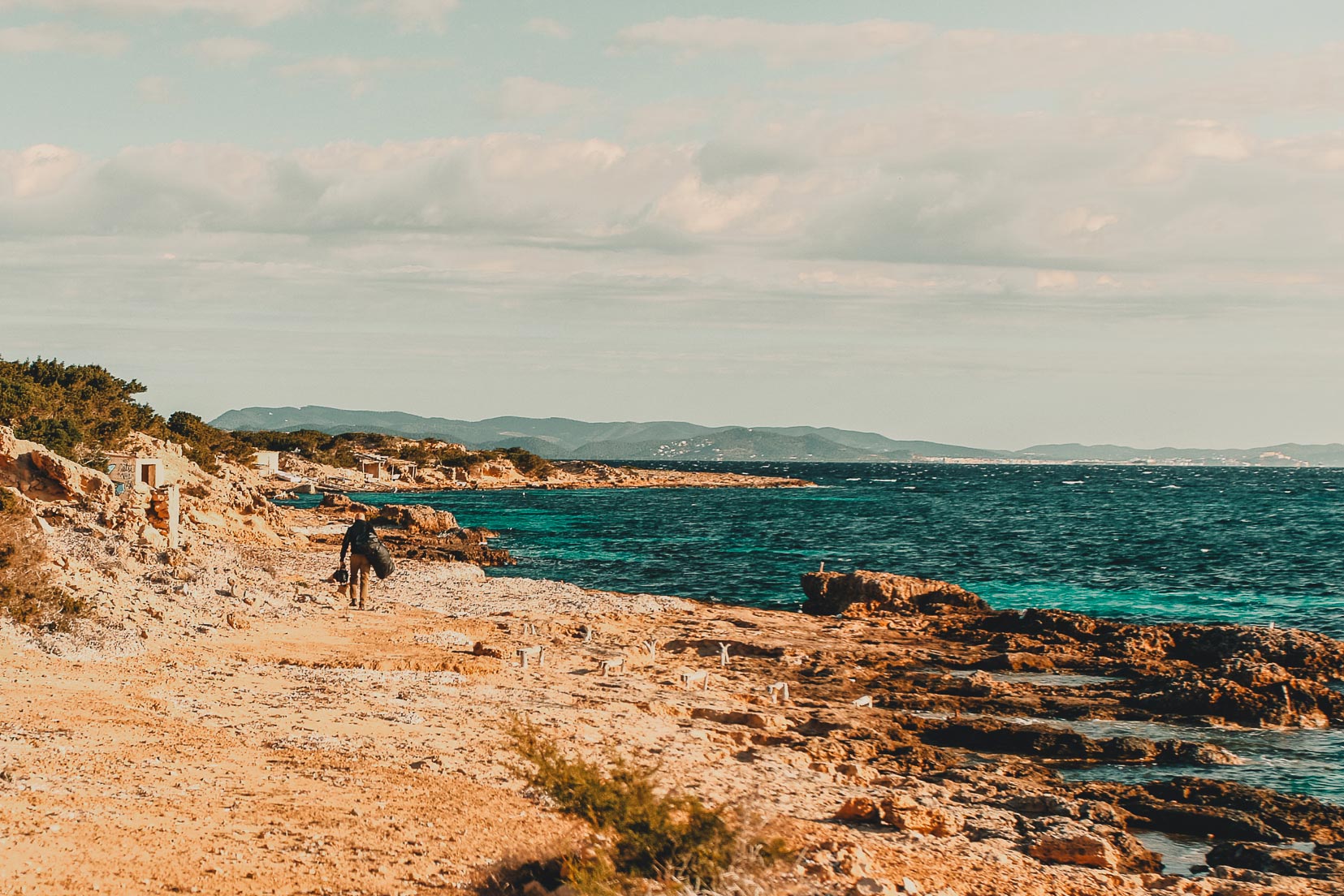 Manu San Felix wandering the shore