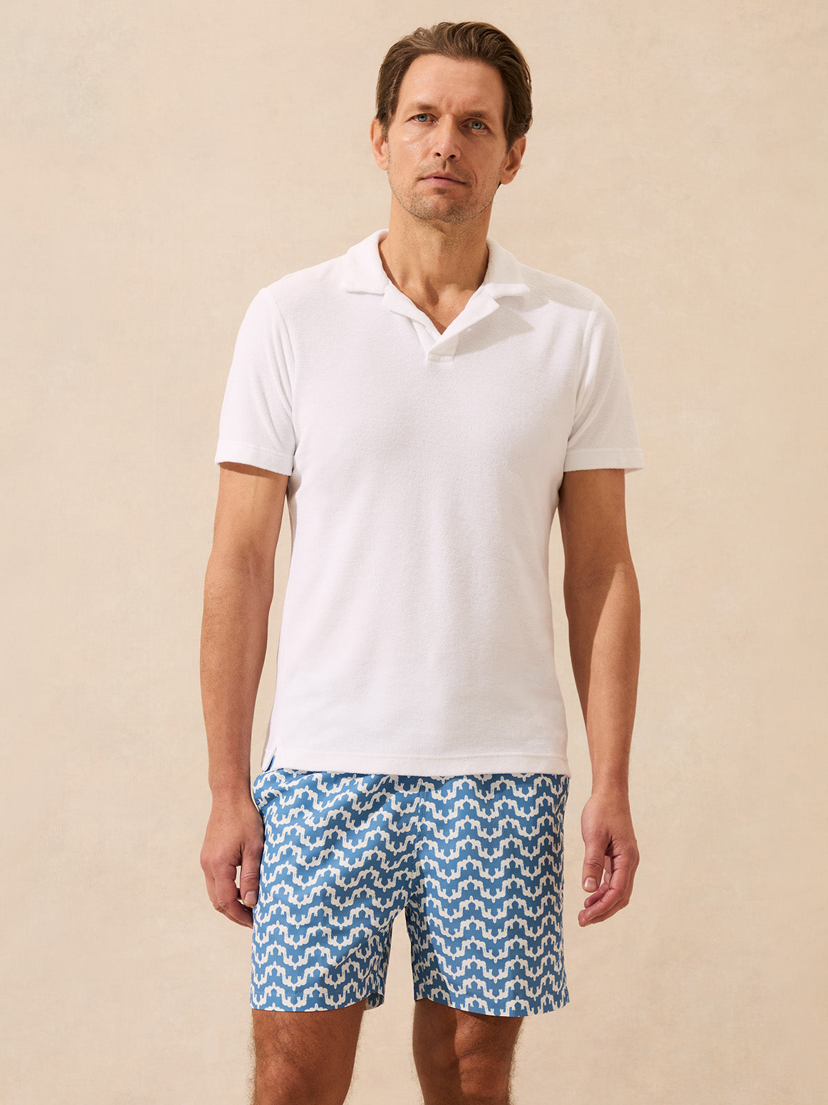 Man wearing a white terry polo shirt
