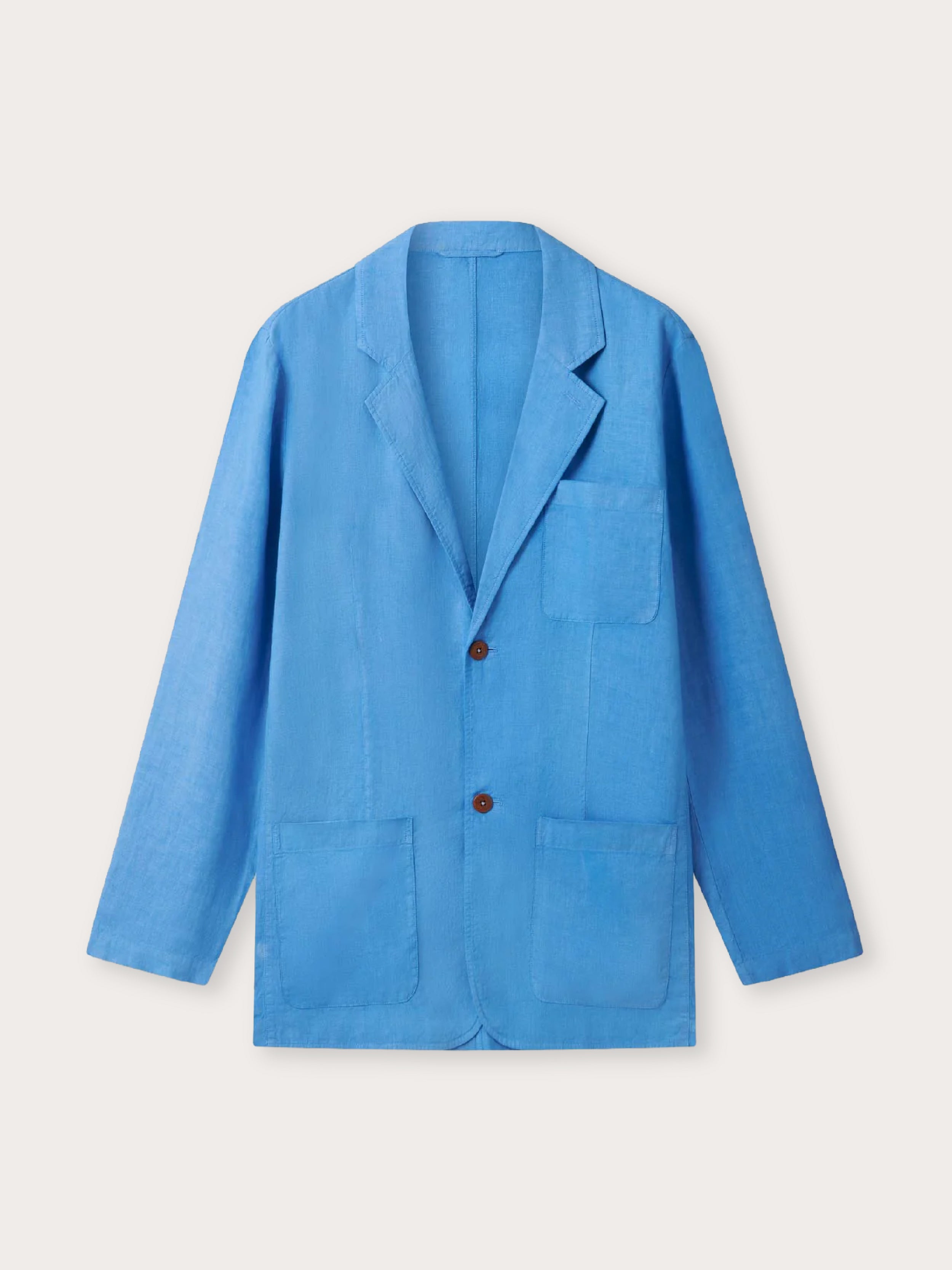 A bright blue blazer jacket with notch lapels, a two-button front, one chest pocket, and two large front patch pockets, shown on a plain light beige background.